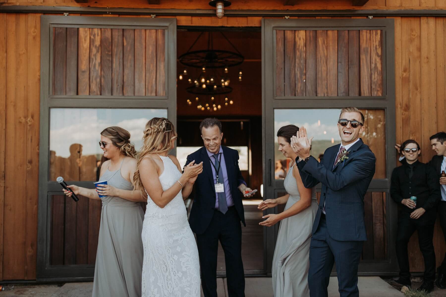 Magician Doug Roy being celebrated by wedding guests.